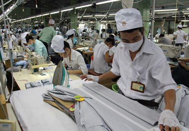 Industria textil de Camboya se esfuerza por enfrentar el COVID-19 ảnh 1