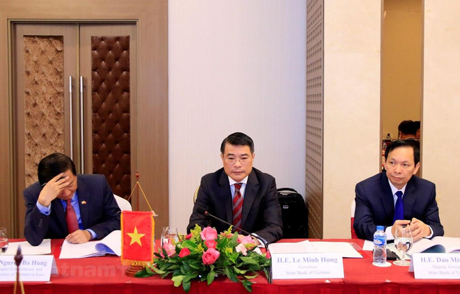 Robustecen bancos estatales de Vietnam y Laos su cooperación ảnh 1