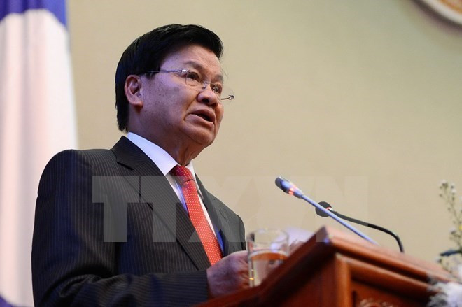 Primer ministro de Laos realiza visita oficial a Singapur ảnh 1 Primer ministro de Laos realiza visita oficial a Singapur ảnh 1