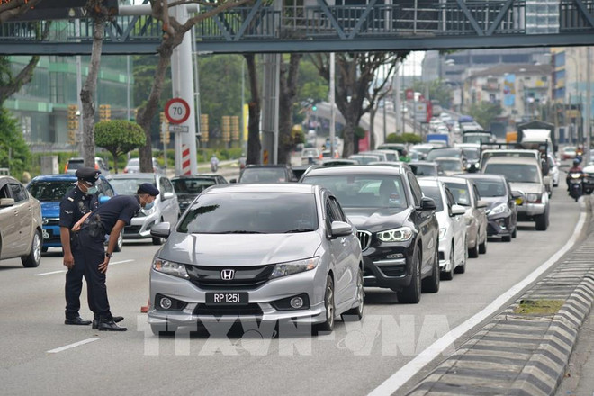 Expertos se muestran cautelosos ante recuperación del mercado laboral de Malasia ảnh 1