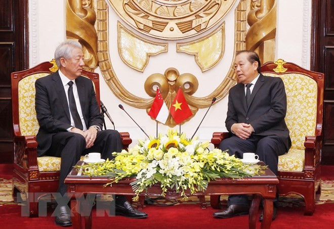 Vicepremier vietnamita recibe a su homólogo singapurense ảnh 1 Vicepremier vietnamita recibe a su homólogo singapurense ảnh 1