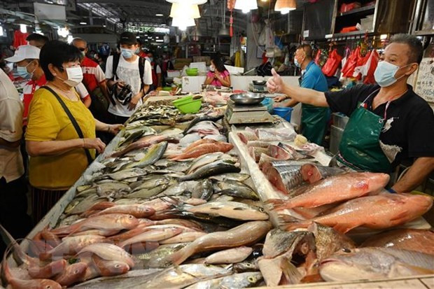 Inflación subyacente de Singapur se modera en marzo ảnh 1