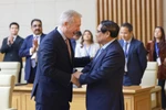 El primer ministro Pham Minh Chinh (derecha) recibe a Ted Osius, presidente y director ejecutivo del USABC (Foto: VNA)