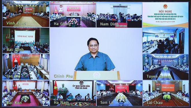 l primer ministro de Vietnam, Pham Minh Chinh, en la conferencia. (Fuente: VNA) vna_potal_thu_tuong_chu_tri_hoi_nghi_danh_gia_thiet_hai_va_khac_phuc_hau_qua_con_bao_so_3_7580027 (1).jpg