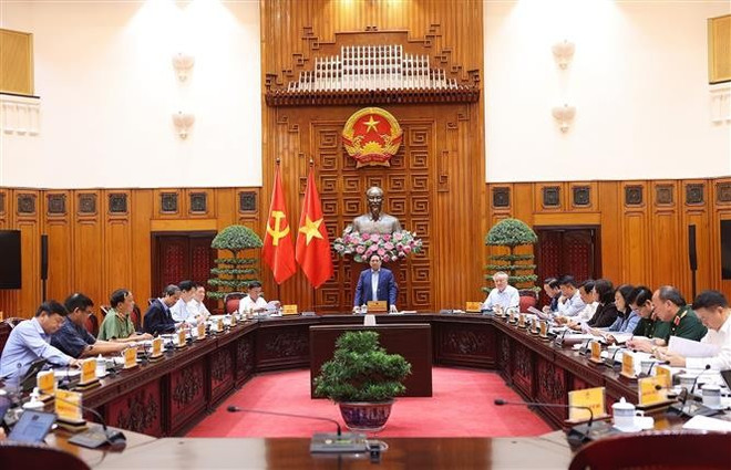 En la cita (Fuente: VNA) vna-potal-thu-tuong-hop-trien-khai-khac-phuc-hau-qua-thien-tai-8327058-2.jpg