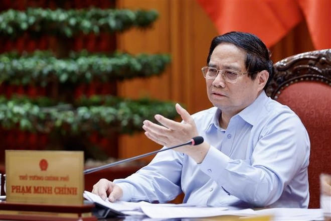 El primer ministro vietnamita, Pham Minh Chinh, habla en el evento (Fuente: VNA) vna-potal-thuong-truc-chinh-phu-hop-ve-du-thao-nghi-quyet-phat-trien-kinh-te-tu-nhan-8018511.jpg