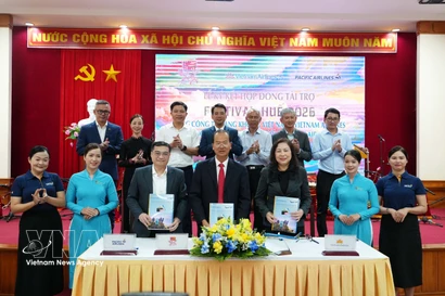 En la ceremonia de firma (Foto: VNA)