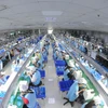 Línea de producción de componentes electrónicos en la empresa Suntech, en el clúster industrial de Thanh Van (Foto: VNA)