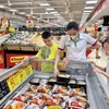Los supermercados en Ciudad Ho Chi Minh aumentan activamente las promociones y programas de estabilización de precios en medio de las fluctuaciones del mercado. (Foto: VNA)