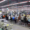 El sector textil, de la confección y del calzado de Vietnam busca pasar de la fabricación por encargo y el ensamblaje a actividades de mayor valor añadido, con más contenido tecnológico y competitividad. (Foto: VNA)