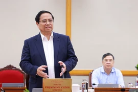 El primer ministro Pham Minh Chinh trabaja con el buró ejecutivo del Comité del Partido en la provincia de An Giang (Foto: VNA)