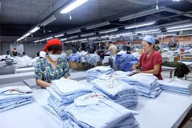 Producción de prendas de vestir para las exportaciones (Foto: VNA)