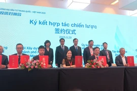 En la ceremonia de firma entre el NSSC y el CCPIT (Foto: VNA)