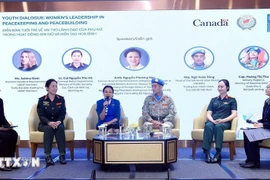 Delegados intercambian en la cita (Foto: VNA)