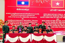 Firma de un reglamento de cooperación operativa entre las unidades participantes (Foto: VNA)