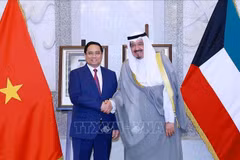 El primer ministro de Vietnam, Pham Minh Chinh, y su homólogo kuwaití, Sheikh Ahmad Al-Abdullah Al-Sabah. (Foto: VNA)