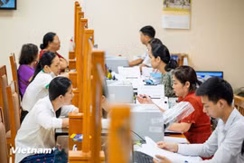 El 20 de junio, a las 8 horas, 126 nuevas comunas y barrios de Hanoi iniciaron simultáneamente las pruebas del modelo de dos niveles. (Foto: VNA)