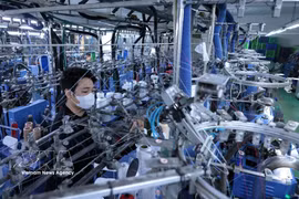 Línea de producción de calcetines destinados a la exportación al mercado japonés. (Foto: VNA)