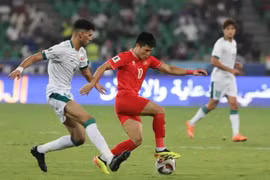 Una jugada en el partido entre Vietnam e Iraq. (Foto: VNA)