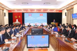 Vietnam y Laos intercambian experiencias en movilización de masas
