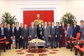 Comisiones Partidistas de Vietnam y Laos fortalecen cooperación