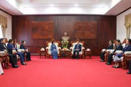 Comparten Vietnam y Laos experiencias en movilización de masas