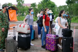 Vietnamitas repatriados desde Singapur completan período de cuarentena