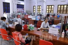 En una sucursal de Agribank en Lao Cai (Foto: VNA)