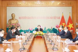 Comisiones de Partidos de Vietnam y Laos intensifican cooperación 