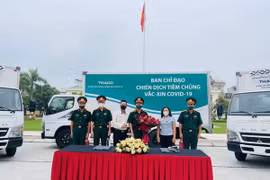 Movilizan camiones refrigerados para transporte de vacunas en Vietnam