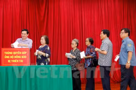 Comunidad vietnamita en Laos inicia campaña de donación para afectados por tifones