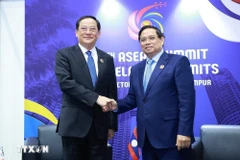 En el encuentro entre el primer ministro laosiano, Sonexay Siphandone y el premier vietnamita, Pham Minh Chinh (Fuente: VNA)