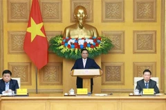 El primer ministro Pham Minh Chinh sostiene el diálogo con empresas chinas (Fuente: VNA)