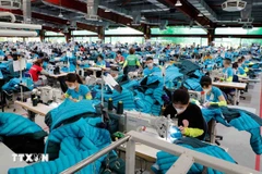 Artículos de costura para exportación a los mercados de EE. UU. y la UE en Maxport Garment Company. (Foto: VNA)