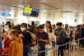 Pasajeros en el Aeropuerto Internacional Tan Son Nhat en Ciudad Ho Chi Minh (Fuente: VNA)