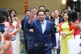 El primer ministro Pham Minh Chinh se reúne con la comunidad vietnamita residente en China (Fuente: VNA)