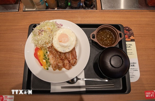 El plato "Arroz partido vietnamita con cerdo" (Fuente: VNA)