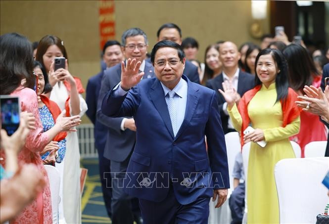El primer ministro Pham Minh Chinh se reúne con la comunidad vietnamita residente en China (Fuente: VNA)