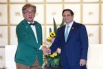 El primer ministro de Vietnam, Pham Minh Chinh, recibe al presidente del Comité de Crecimiento Verde y Neutralidad en Carbono de Corea del Sur, Kim Sang-huyp. (Fuente: VNA)