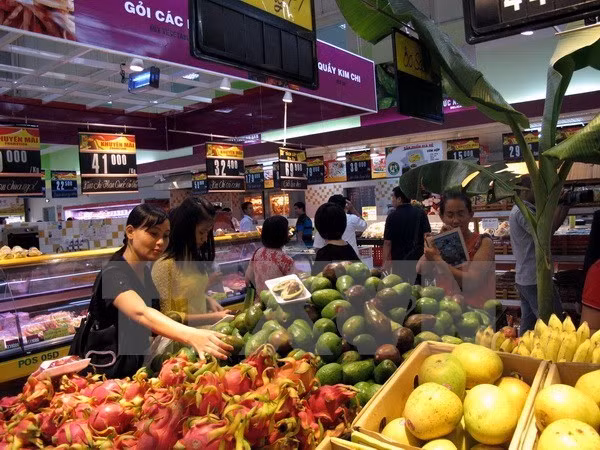 Consumidores vietnamitas optimistas sobre desempeño de la economía nacional, según encuesta ảnh 1