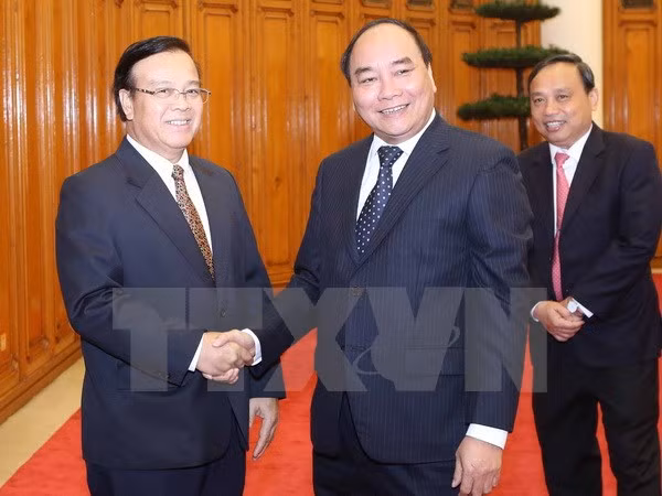 Cooperación entre Vietnam y Laos en uso de ODA ảnh 1