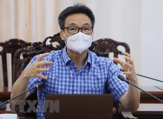 Implementación sincrónica de “estrategia regional” para controlar el COVID-19 en el sur de Vietnam ảnh 1