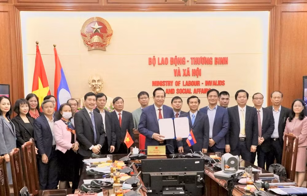 Robustecen Vietnam y Laos cooperación en asuntos laborales y bienestar social ảnh 1