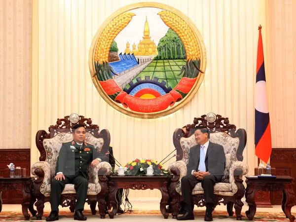 Premier de Laos resalta labor de búsqueda de restos de soldados vietnamitas caídos en su país ảnh 1