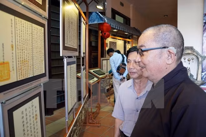 Exhiben registros históricos del patrimonio mundial de Hoi An ảnh 1