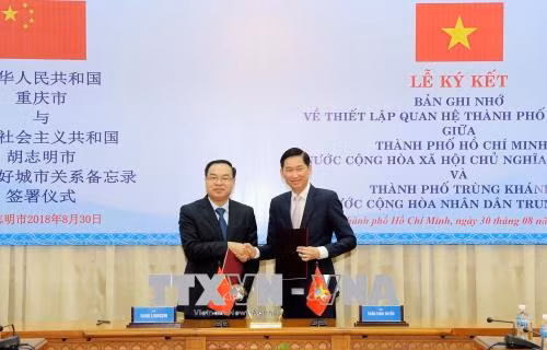 Ciudad Ho Chi Minh y municipio chino de Chongqing establecen relaciones de amistad ảnh 1