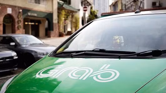 Toyota invierte mil millones de dólares en Grab, líder de transporte compartido en Asia ảnh 1