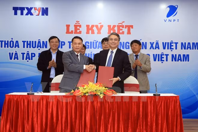 Agencia Vietnamita de Noticias y Grupo de Correos y Telecomunicaciones fomentan cooperación en labor informativa ảnh 1