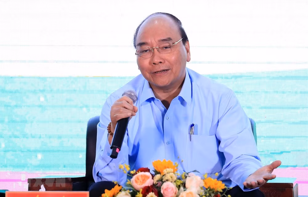 Dialoga primer ministro de Vietnam con agricultores nacionales ảnh 1