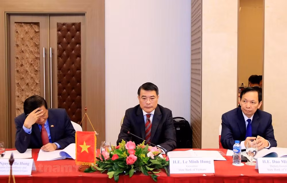 Robustecen bancos estatales de Vietnam y Laos su cooperación ảnh 1